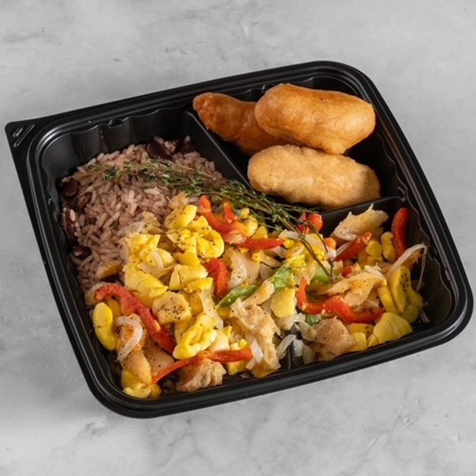 Takeout tray filled with seasoned rice, mixed vegetables, sliced chicken, and two golden fried pastries.
